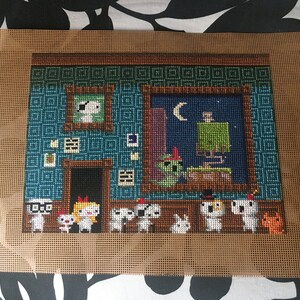 May include: Cross-stitch embroidery of a room with a blue wall, a window with a crescent moon, and a group of white characters with different hats and accessories. The characters are standing in front of the window.