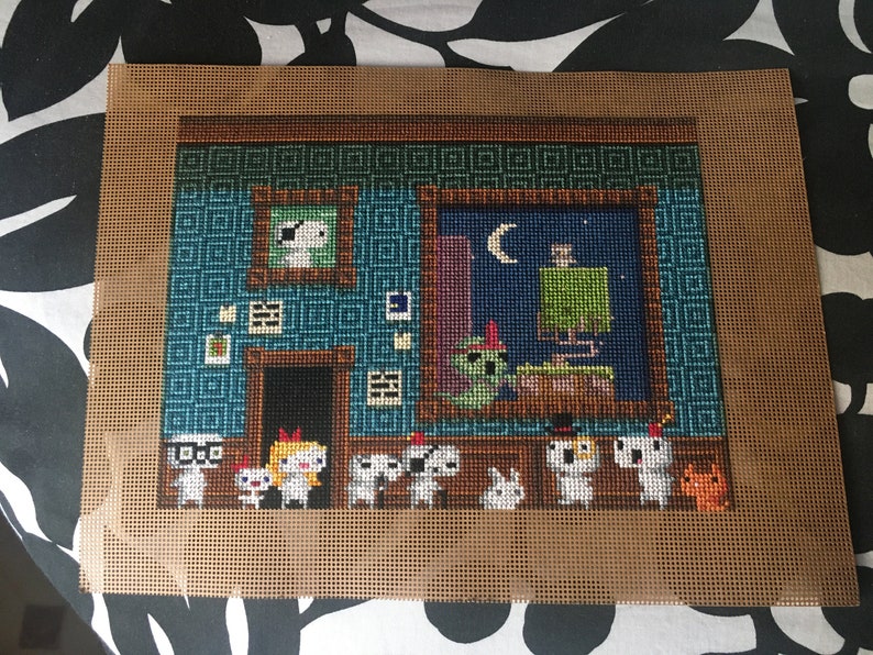 May include: Cross-stitch embroidery of a room with a blue wall, a window with a crescent moon, and a group of white characters with different hats and accessories. The characters are standing in front of the window.