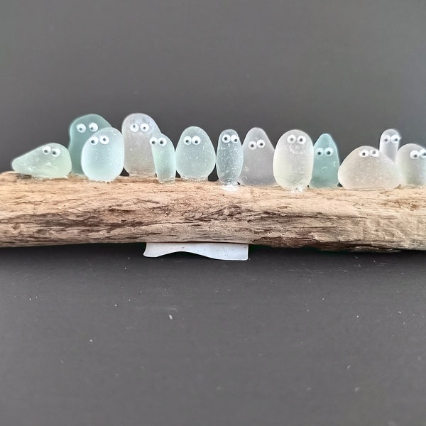 Large rare pastel shades of Seaham Sea glass "Pebble People" set on driftwood