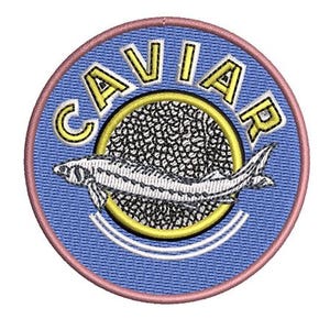 May include: Embroidered patch with a blue background and a pink border. The patch features the word "CAVIAR" in yellow letters, a sturgeon fish, and a yellow circle with a black and white pattern.