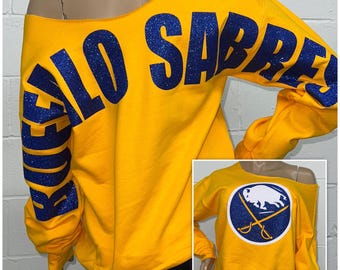 Sabres Billboard Print Off The Shoulder Sweatshirt | Buffalo Sabres glitter sweatshirt