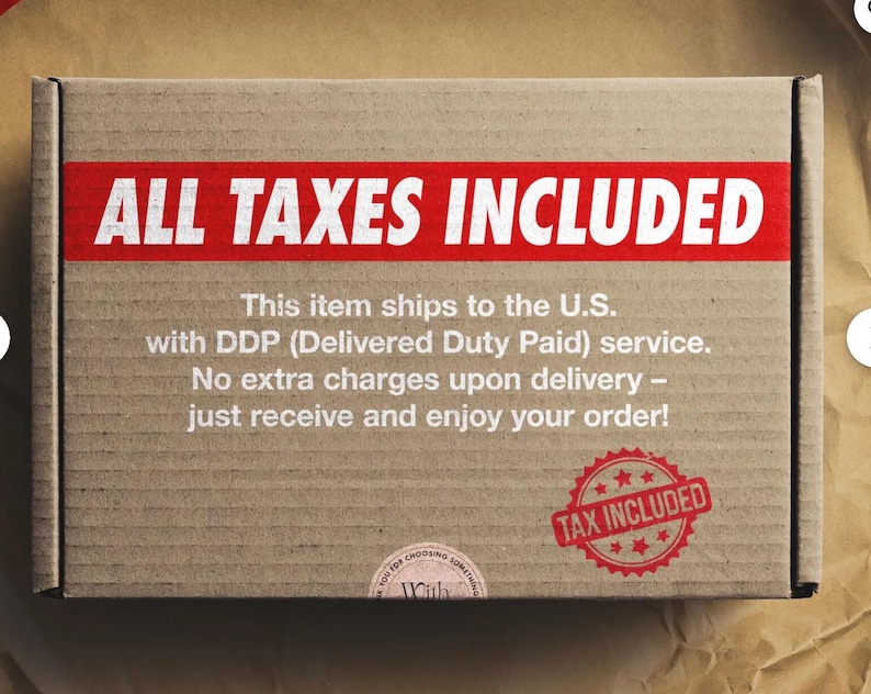 May include: A brown cardboard box with the words "ALL TAXES INCLUDED" in white on a red banner. A red stamp with the text "TAX INCLUDED" is also visible. The box is on a brown surface.