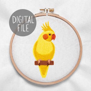 May include: A digital file of a yellow cockatiel bird embroidery design. The bird is perched on a brown branch, with a red beak and orange cheek patches. The design is set in a wooden embroidery hoop. The text "DIGITAL FILE" is in a gray circle.