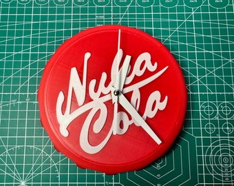 May include: A red circular clock with white hands and the text "Nuka Cola" in white lettering.