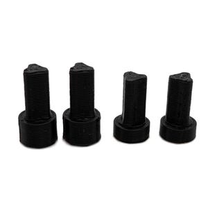 May include: Four black plastic furniture leg risers. The risers are cylindrical with a textured surface and a rounded top.