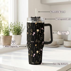 Premium Stainless Steel Tumbler 40oz Capacity Insulated Travel Mug Wildflower Black Design With Handle Straw Included Double Wall Construction Keeps Beverages Temperature Perfect Hot Cold Drinks Large Container Botanical Pattern Comfortable