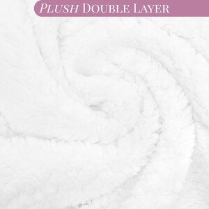 May include: A white plush double layer fabric with a soft, textured, and fleecy surface. The material is arranged in a swirling pattern, creating depth and shadows within the folds. The text PLUSH DOUBLE LAYER is visible in a purple banner.