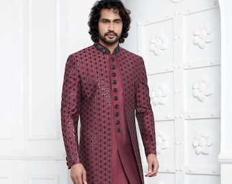 May include: A maroon long-sleeved jacket with a black patterned design and matching maroon trousers. The jacket has a mandarin collar and a button closure.