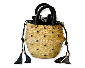Basket straw bag decorated with crystals and pearls all around.