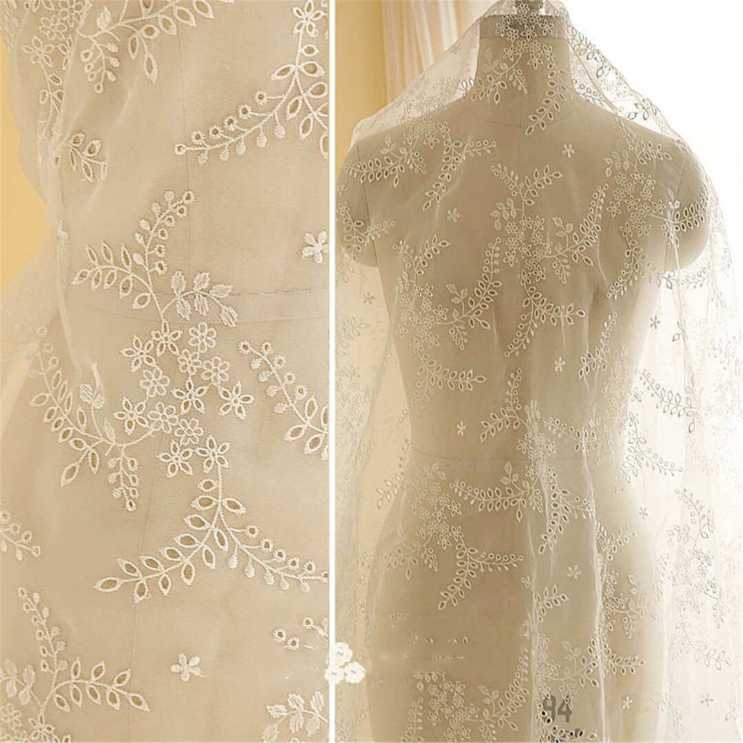 IVORY FLORAL DESIGN WITH CORD EMBROIDERY ON A MESH LACE-SOLD BY YARD. main image 0