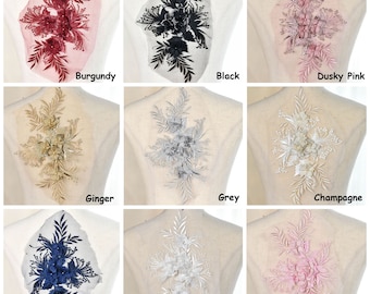 May include: Nine embroidered floral appliques in various colors, including burgundy, black, dusty pink, ginger, grey, champagne, navy, off white, and pink. Each applique features a cluster of flowers and leaves.