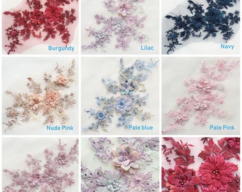 May include: Assortment of floral lace appliques in various colors, including burgundy, lilac, navy, nude pink, pale blue, pale pink, and dusky pink. Each applique features intricate floral designs with delicate beading and sequins.