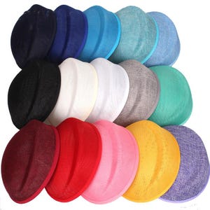 May include: A selection of colourful, lightweight hats in shades of blue, green, red, and yellow. The hats have a rounded shape with a brim and are made of a woven material. The hats are arranged in a visually appealing display.