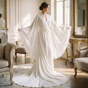 white satin dress with feathers Birds of a Feather Mini Wedding Dress
