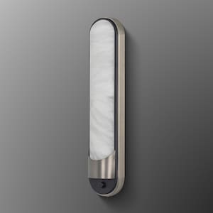 May include: A vertical wall sconce featuring a long, rounded rectangular shape with a white, marbled glass diffuser. The fixture has a brushed metallic frame and a dark gray base section at the bottom, which includes a small, circular push-button switch.