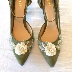 Olive green shoes in soft suede with beautiful hand embroidery in shades of pink and green with ankle strap. High heel
