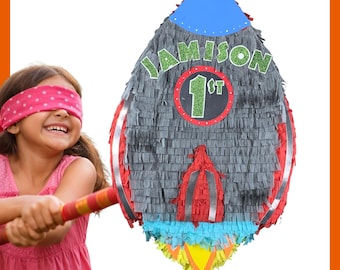Custom Space Rocket to the Moon Piñata 20". Very sturdy for extra fun. Choose colors and details. Secure shipping