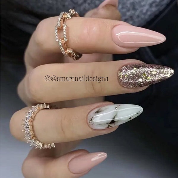 Press on Nails in Fleeting Marble | Luxury Nails | Rose Gold Nails | Marble Nails | Nails in the image are Medium Almond
