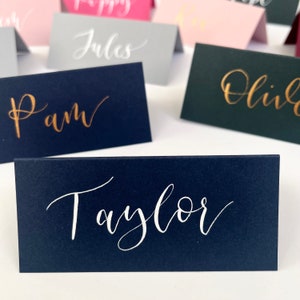 Handwritten navy and white wedding place names, wedding and Christmas place cards, wedding place settings, navy and gold wedding