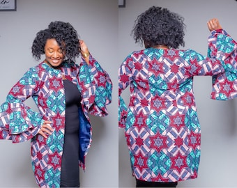 May include: A long-sleeved, open-front jacket with a geometric pattern in shades of red, blue, and green. The jacket has a ruffled, layered sleeve design.