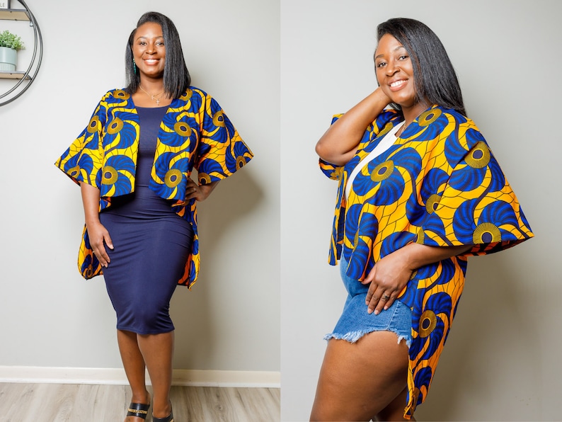 May include: A yellow and blue patterned kimono-style cardigan with a high-low hemline. The cardigan has a relaxed fit and features a wide, flowing sleeve.