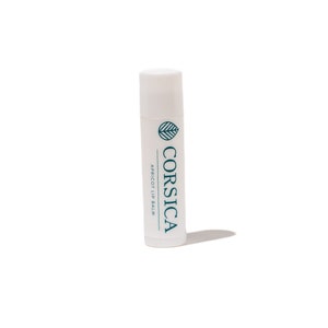 May include: White tube of apricot lip balm with the brand name "CORSICA" and a green leaf logo printed on the tube.
