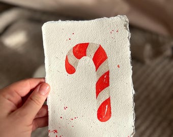 Carte postale aquarelle peinte à la main avec des cannes de bonbon