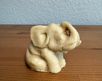 Vintage Elephant Figurine Sitting Trunks Up