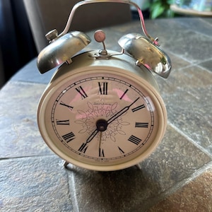 May include: A set of three ceramic mugs with a speckled, matte finish. The mugs are in shades of cream, light gray, and dark gray. Each mug has a simple, minimalist design, perfect for coffee or tea.