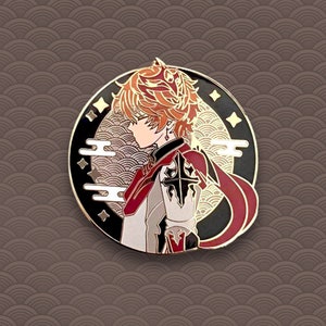 May include: A gold-toned enamel pin featuring a character with orange hair, wearing a red and white outfit, against a black and gold background with a stylized cloud design.