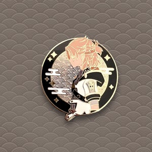 May include: A round enamel pin featuring a character with peach-colored hair and a black and white outfit. The pin has a gold border with star accents and a wave pattern background.