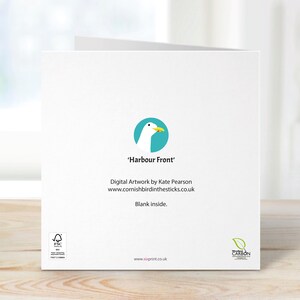May include: A white greeting card with the text "Harbour Front" and a teal circle logo featuring a seagull. The card includes the artist's name and website. The inside of the card is blank.
