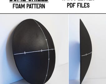 May include: A black foam dome shield pattern for crafting. The pattern is marked with white lines and includes instructions for assembling the shield. The pattern is available in A4/US Letter PDF files.
