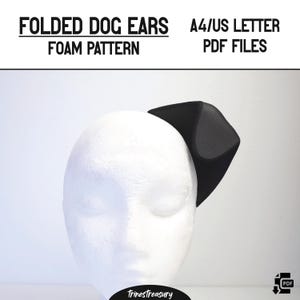 May include: A black foam dog ear attached to a white styrofoam head. The text "FOLDED DOG EARS FOAM PATTERN" and "A4/US LETTER PDF FILES" are printed at the top. The TrinesTreasury logo is at the bottom.