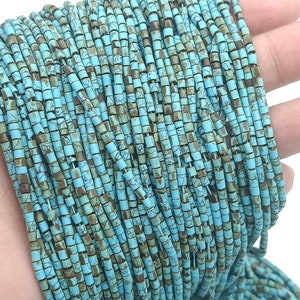 May include: A strand of turquoise blue and brown square beads. The beads are small and have a mottled, rustic appearance.