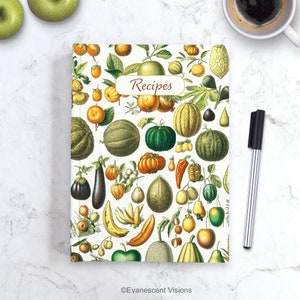 May include: A white recipe book cover featuring a colourful illustration of assorted fruits and vegetables, such as apples, pears, melons, bananas, and aubergine. The title "Recipes" is printed in brown text on the cover.