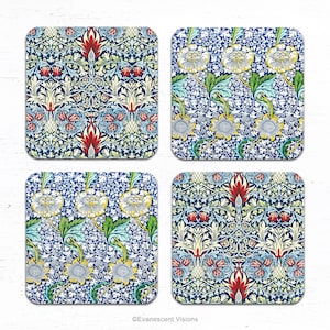 May include: Four square coasters with detailed floral patterns. Each coaster displays a unique design, featuring stylized flowers, leaves, and scrolling vines in blue, red, white, and green. The coasters are arranged on a white surface.