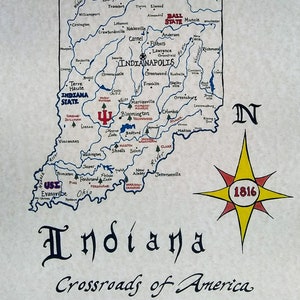May include: A hand-drawn map of Indiana with the state's major cities and towns labeled. The map is surrounded by a blue border and includes a compass rose with the year 1816 in the center. The text "Indiana Crossroads of America" is written below the map.