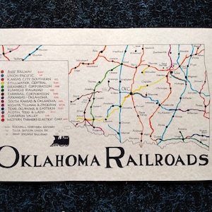 May include: A vintage map of Oklahoma railroads, featuring a detailed network of colored lines representing different railway companies. The map includes the text "Oklahoma Railroads" and a small illustration of a train.