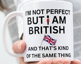May include: White ceramic mug with black text that reads "I'm not perfect but I am British and that's kind of the same thing". A small Union Jack flag and a cartoon image of a British soldier are printed on the mug.