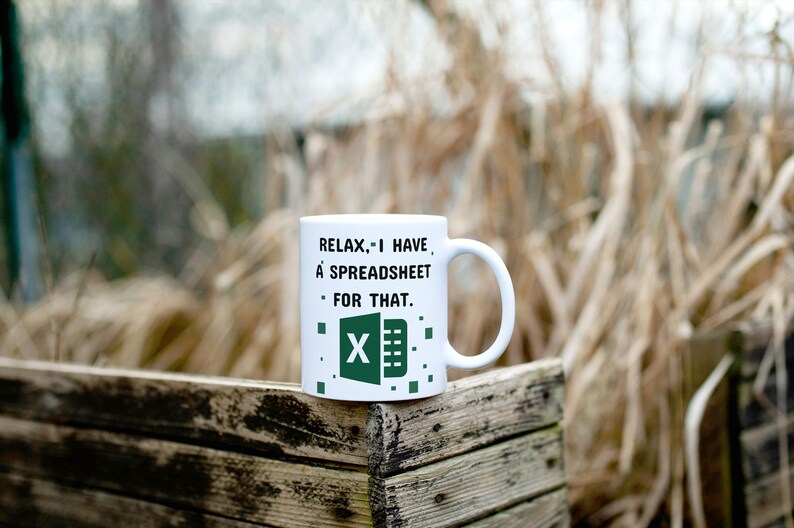 Puede incluir: Taza de cer&aacute;mica blanca con un logotipo de Microsoft Excel verde y blanco y el texto "Relax... I have a spreadsheet for that."