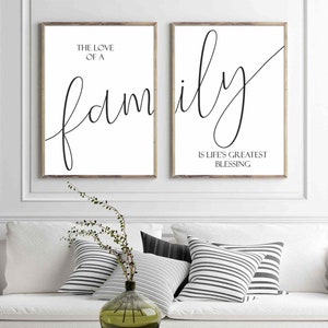 May include: Two black and white prints with the text "The love of a family is life's greatest blessing" in a cursive font.