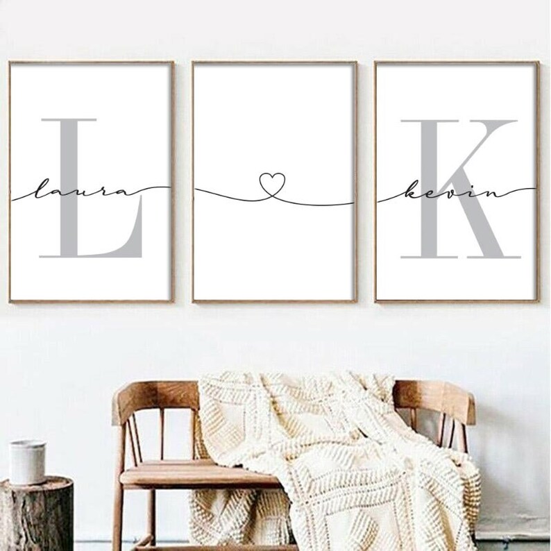 May include: Three framed prints featuring the letters L, a heart, and K, with the names Laura and Kevin written beneath each letter.