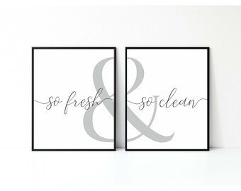 May include: Two framed prints with the text "so fresh & so clean" in a gray ampersand design. The prints are on a white background with black frames.