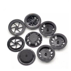 May include: A close-up of eight black plastic vent covers. The vent covers have different designs with a variety of holes and slits. The vent covers are arranged in a pile on a white surface. CLEARANCE SALE LIMITED QUANTITIES is written in red text on a white background.