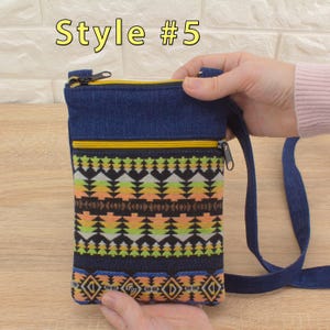 Handmade crossbody bag labeled 'Style #5', featuring a dark blue denim top section, yellow (golden color) zippers, and a bottom pocket made from tapestry textile (geometric pattern).