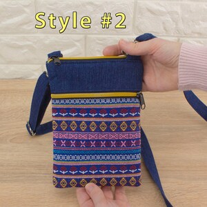 Handmade crossbody bag labeled 'Style #2', featuring a dark blue denim top section, yellow (golden color) zippers, and a bottom pocket made from tapestry textile (geometric pattern).