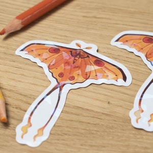 Polilla holográfica naranja Pegatina