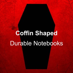 Może przedstawiać: Notesy w kształcie trumny z tekstem "Coffin Shaped Durable Notebooks" na czerwonym tle z czarnym wzorem pajęczyny.