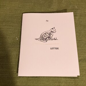 Um cartão de felicitações com uma carta OK